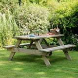 Wooden picnic table with food and drinks in a garden setting