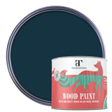 A can of Thorndown wood paint in front of an open round paint can showing the dark teal color. The can features a red and white label with a stylized red fox logo.
