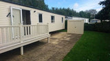 Trojan plus Caravan shed storage, located next to a caravan.