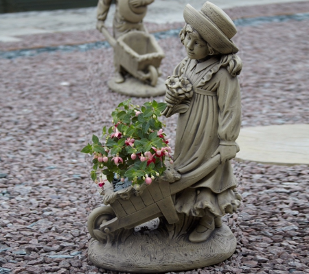 Girl with barrow statue